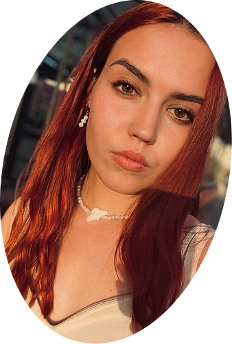 Portrait of a person with red hair in warm evening light